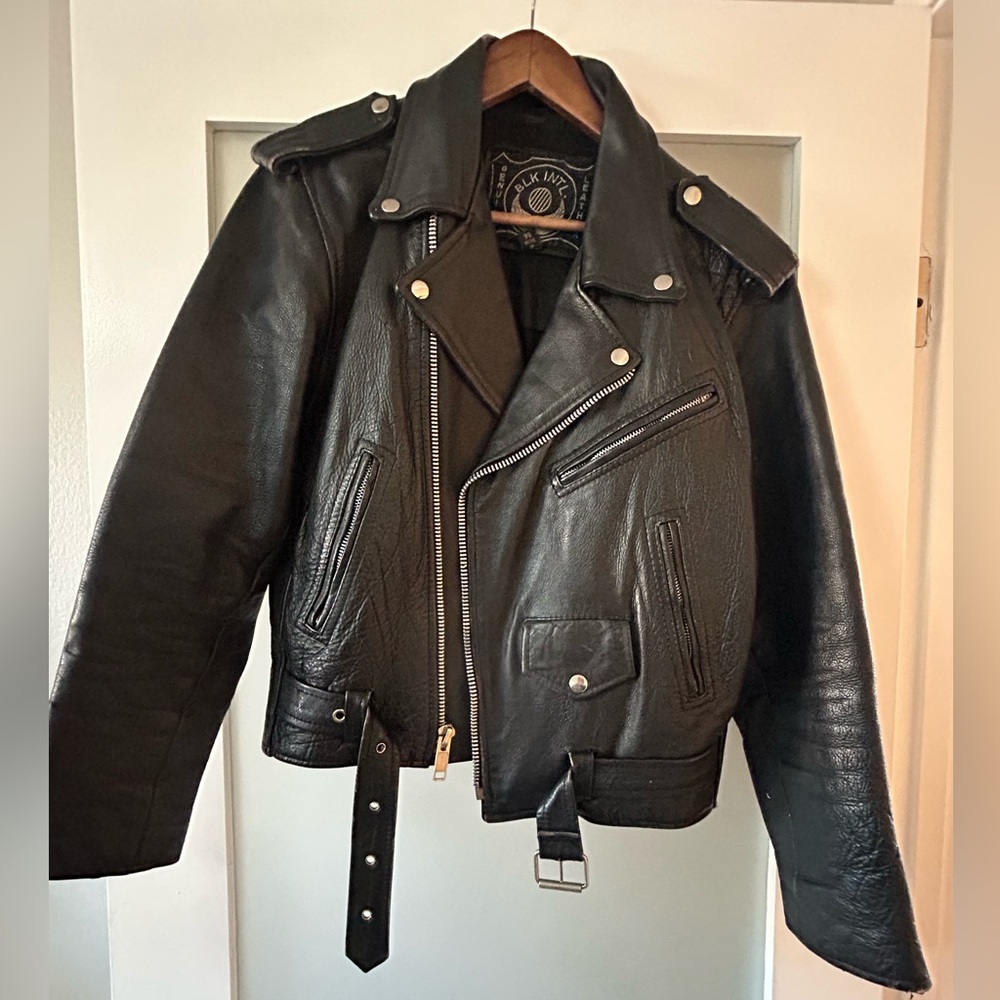 Vintage leather jacket with Harley Davidson patch work on the back
